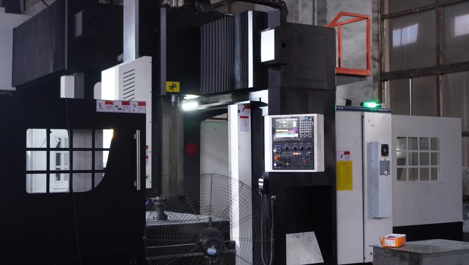 CNC machine control station and spindle area