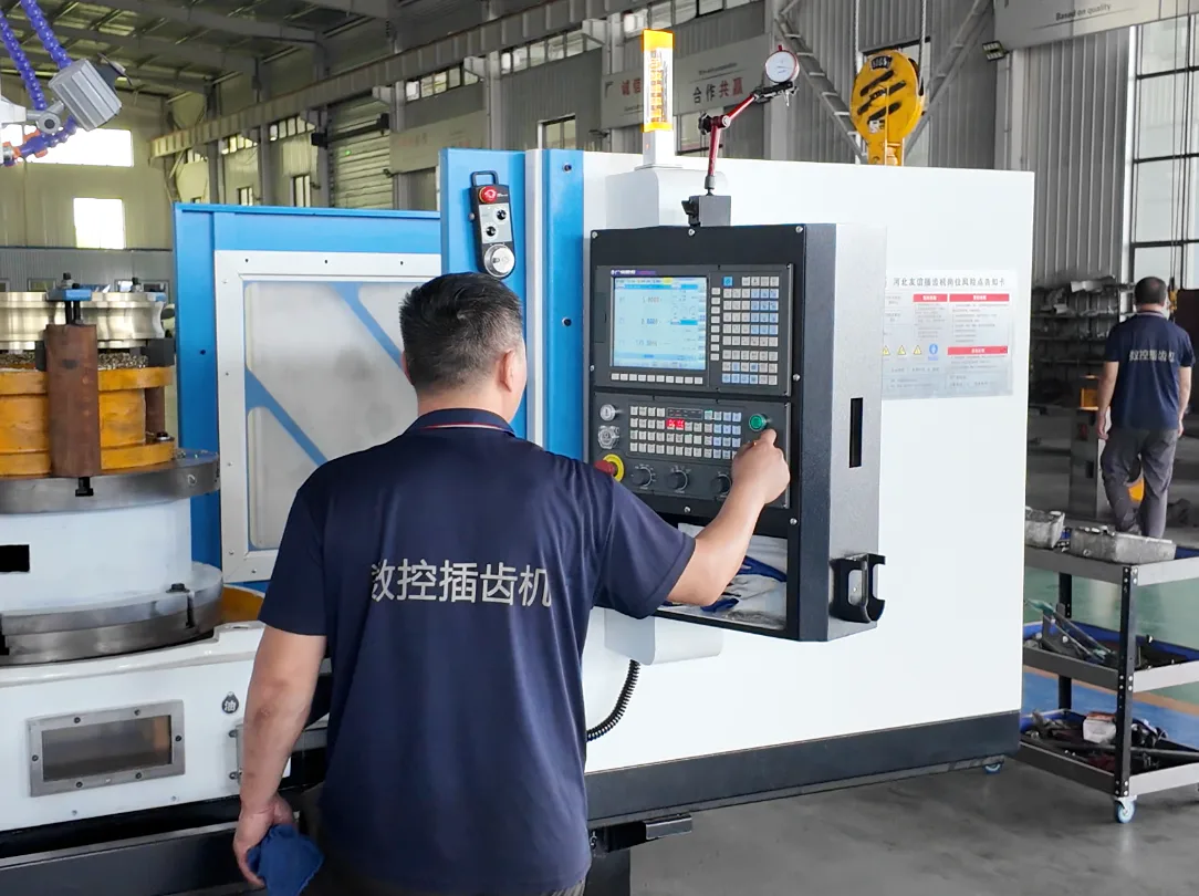 Operator using CNC gear shaping machine in Changyi workshop